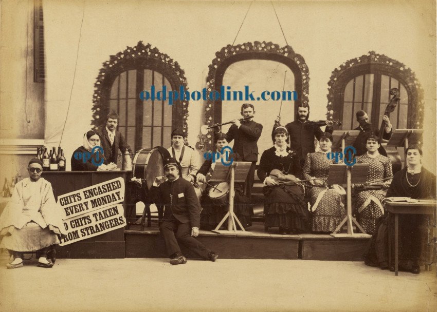 Band performing on street 1885